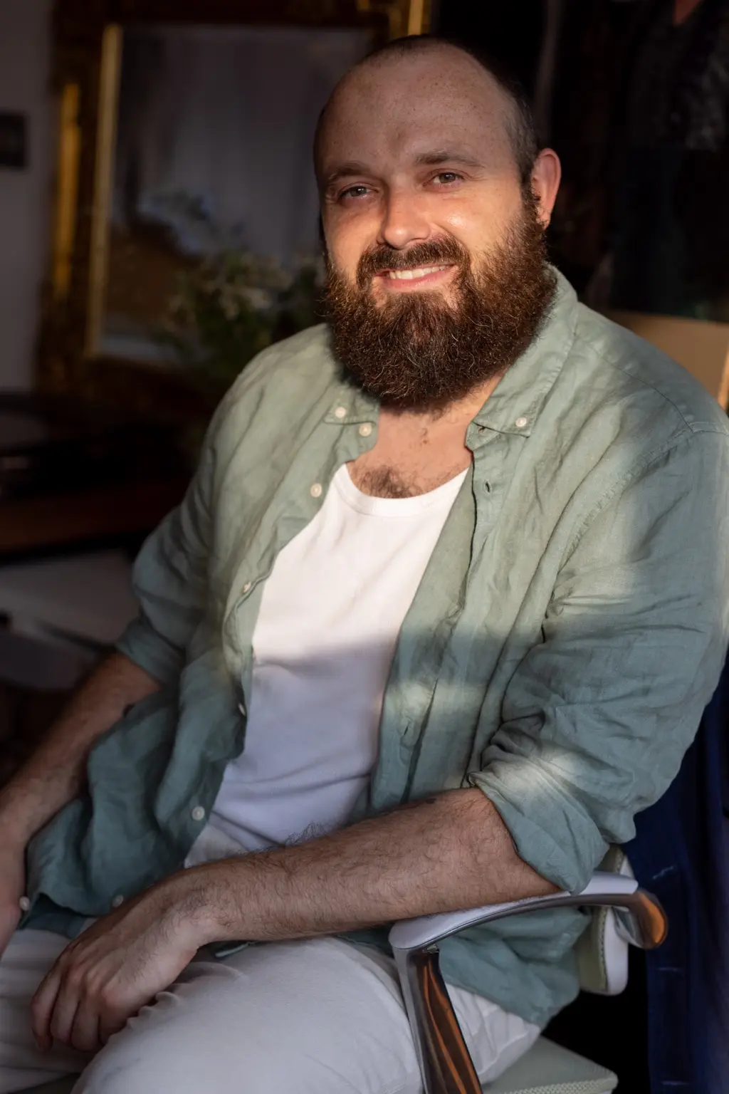 Robert Moutrey seated and smiling